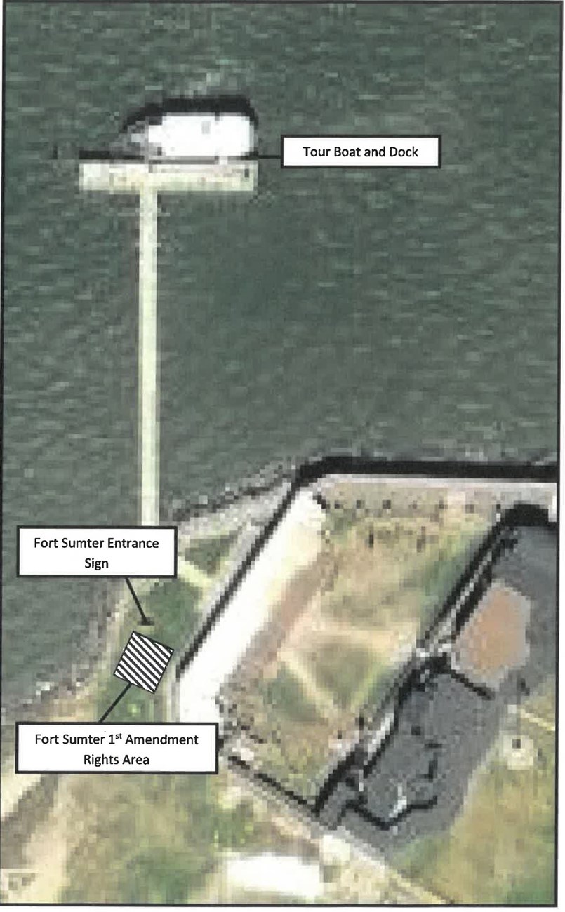 Aerial View of Fort Sumter, the island and dock. First Amendment Rights area is marked behind the Fort Sumter Entrance Sign. This is outside of the fort close to the area where the dock intersects the fort.