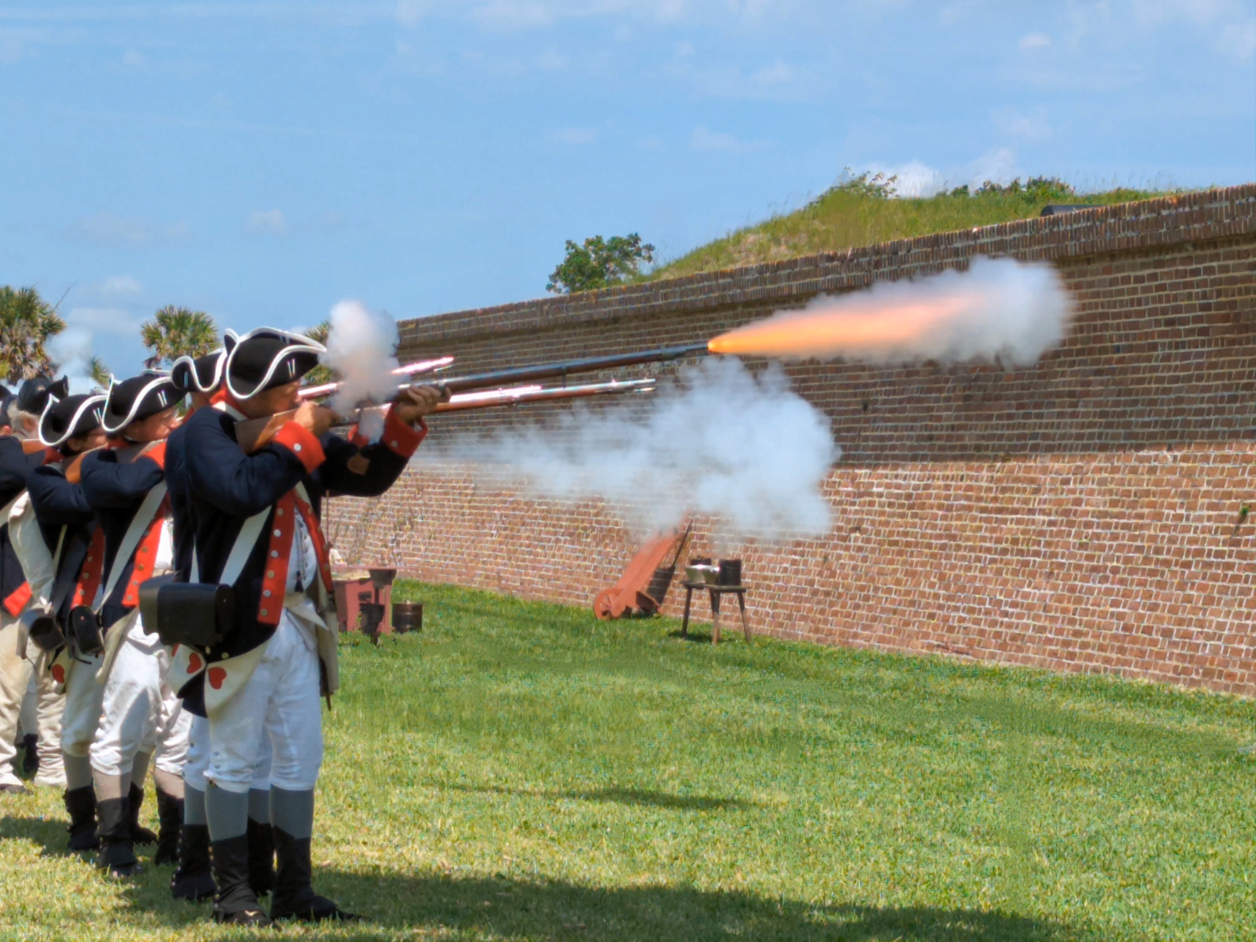 Carolina Day commemoration A row of living historians fire muskets during Carolina Day events