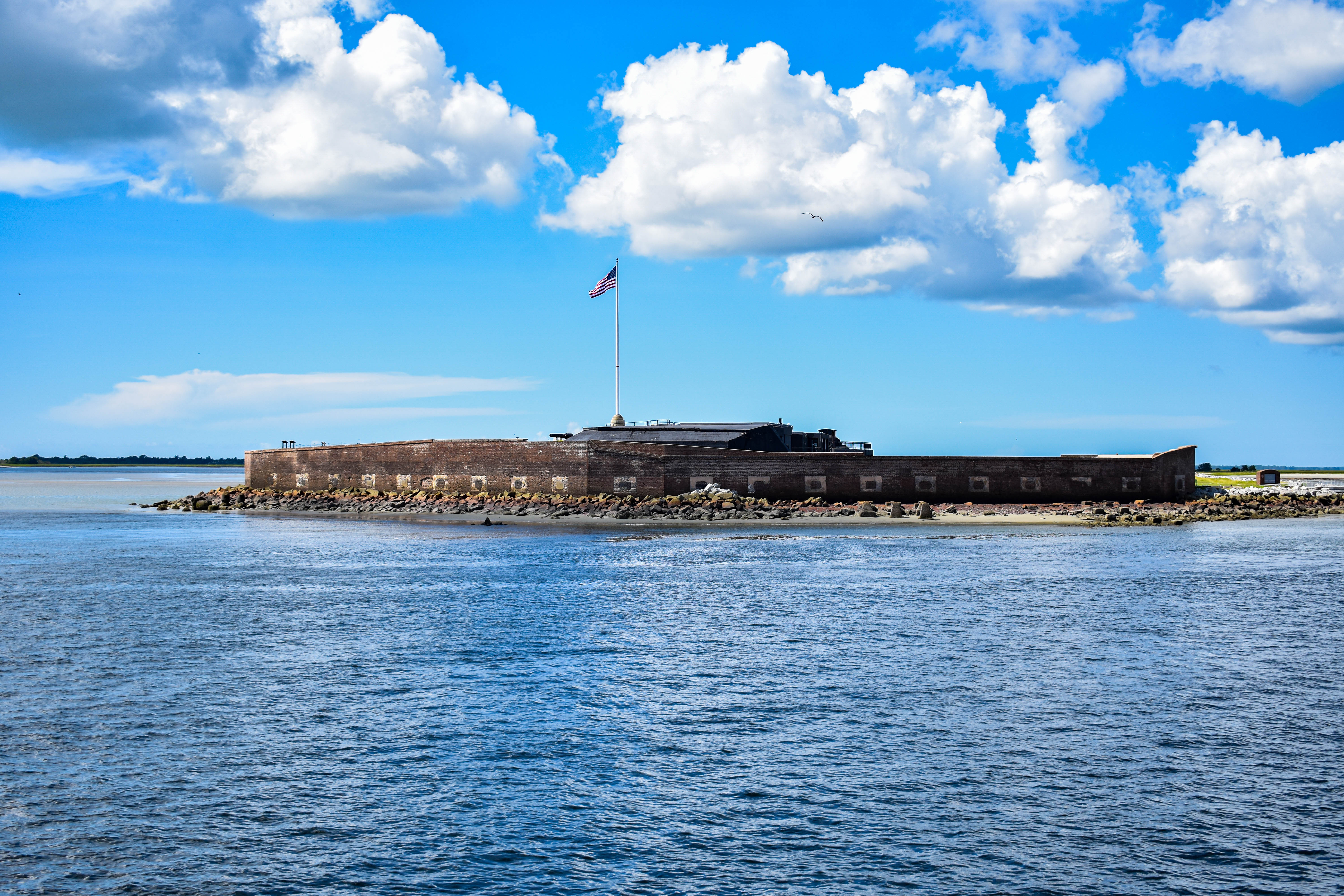 Fort Sumter Press Release Fort Sumter on a clear sunny day with the American flag flying