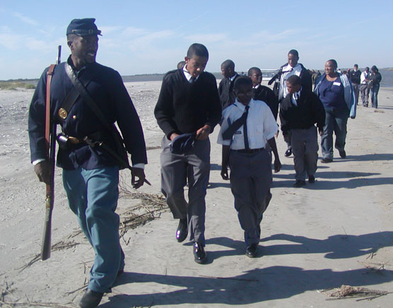 Ranger/reenactor leading a group of children.
