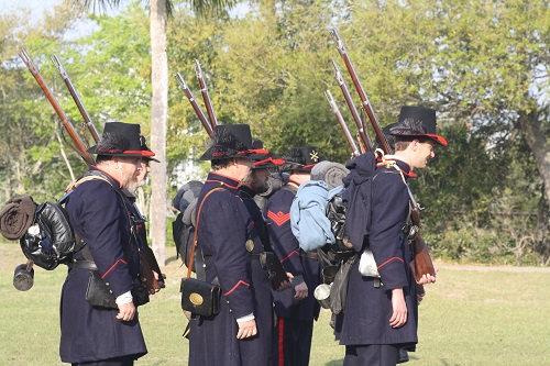 Reenactors in Union uniforms standing in formation