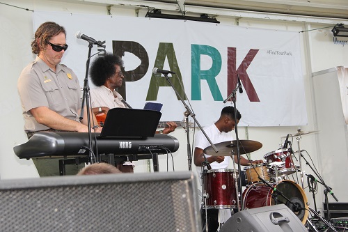 Arrowhead Band playing a concert with musicians using drums, piano and guitar