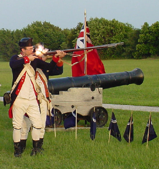 Man in Revolutionary War uniform firing a musket.