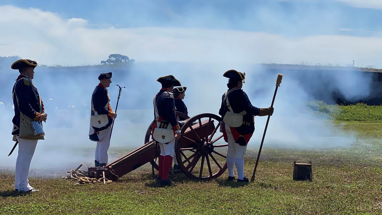 Living historians fire a revolutionary period cannon