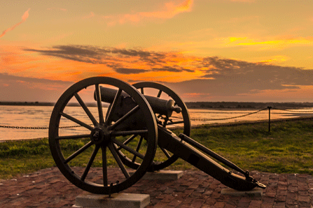 The sun sets behind a 12-pounder Mountain Howitzer at Fort Sumter. The sun sets behind a 12-pounder Mountain Howitzer at Fort Sumter.