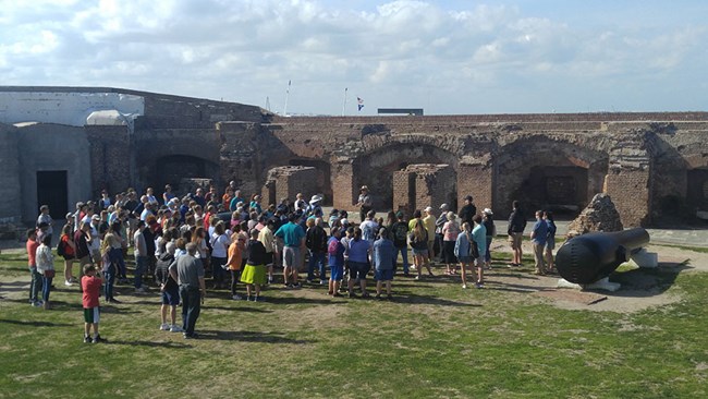 Crowd attending a ranger program on the parade ground at Fort Sumter
