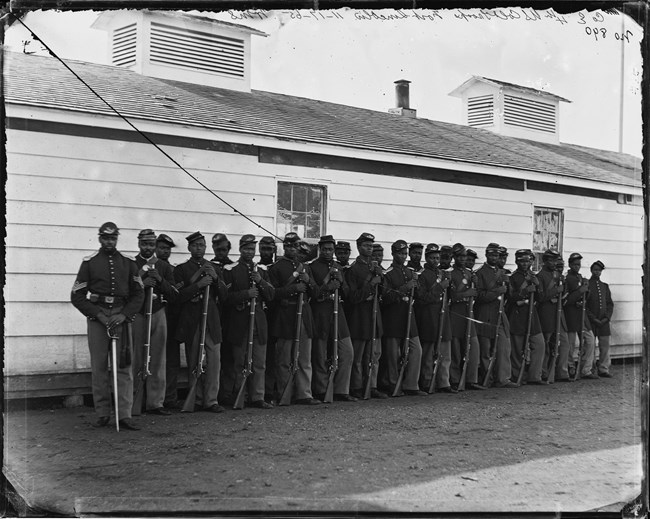 African American Soldiers lined up in Civil War era uniforms