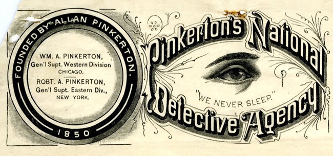 Logo with "Pinkerton's National Detective Agency" in 19th century lettering surrounding an illustration of a single open eye and the phrase "We Never Sleep"