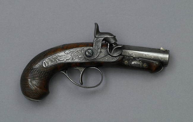 Small wood-handled single shot pistol used by John Wilkes Booth to assassinate President Lincoln