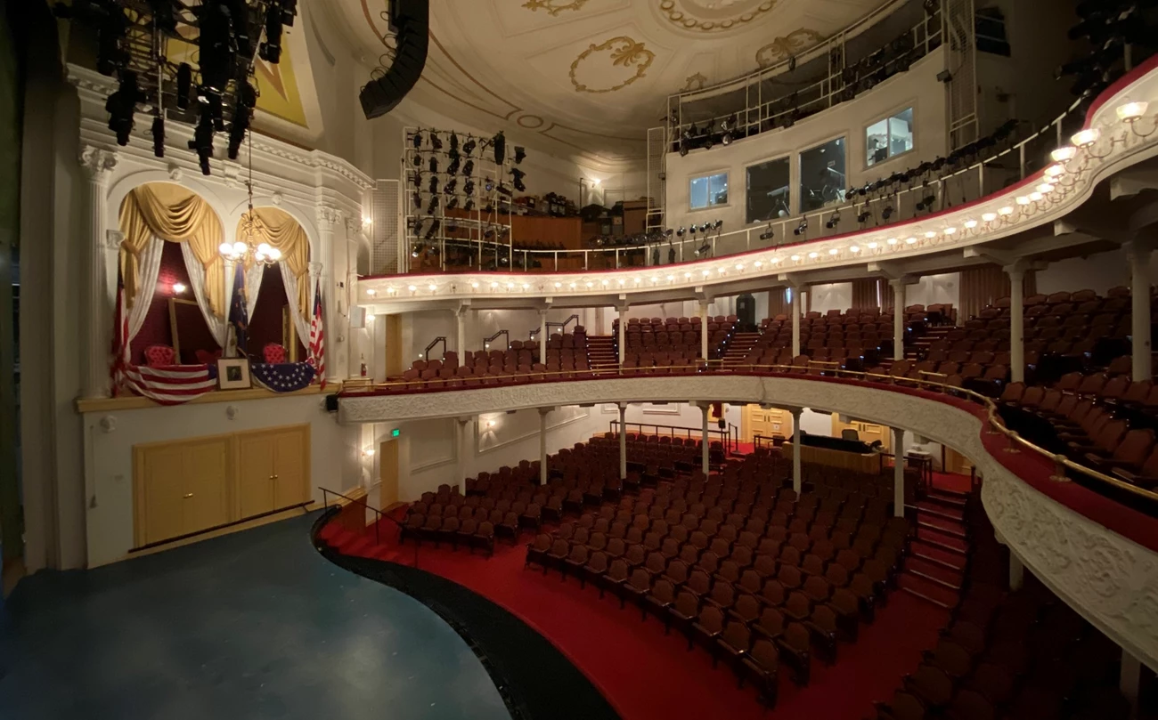 Ford's Theatre Interior today Photo of theatre stage and audience seating on three levels, with the box seats decorated with flags on the other side of the stage