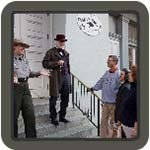 park ranger with visitors on steps