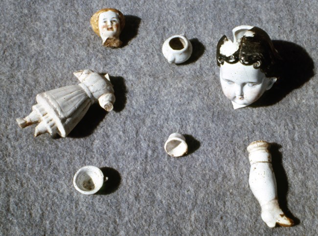 broken parts of porcelain doll