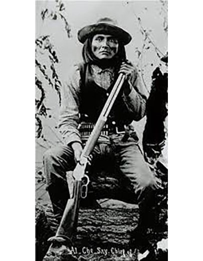 Indian scout holding rifle