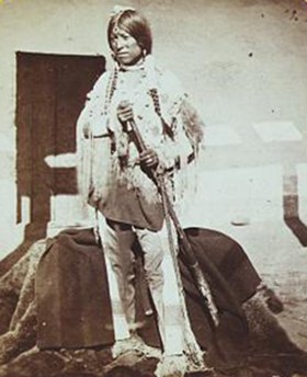 male jicarilla indian holding staff