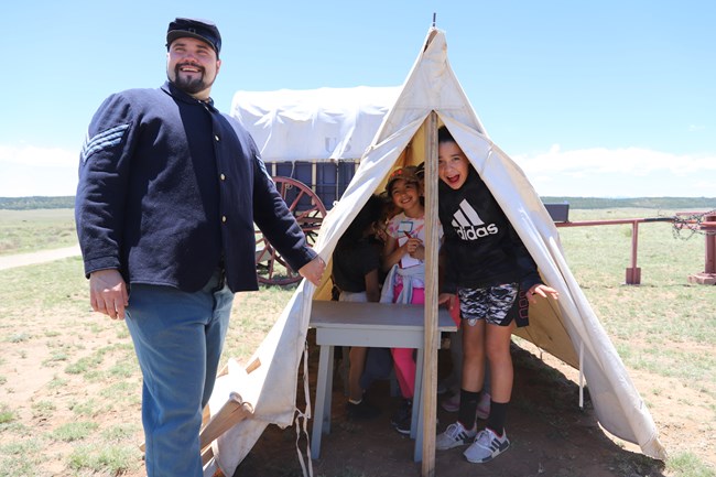 Kids explore an army tent at the 2021 Junior Ranger Camp
