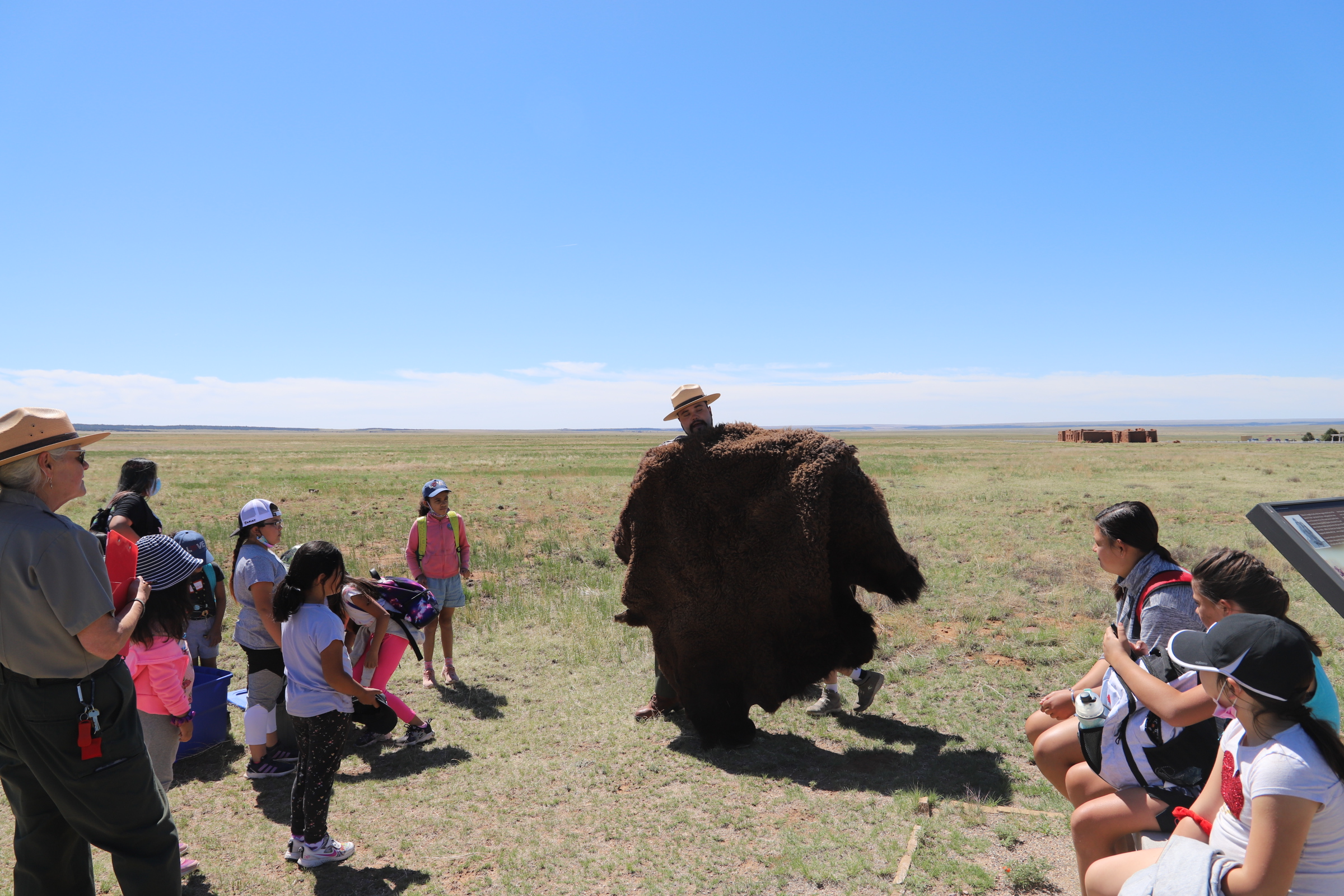 Ranger Greg holds up a buffalo hide