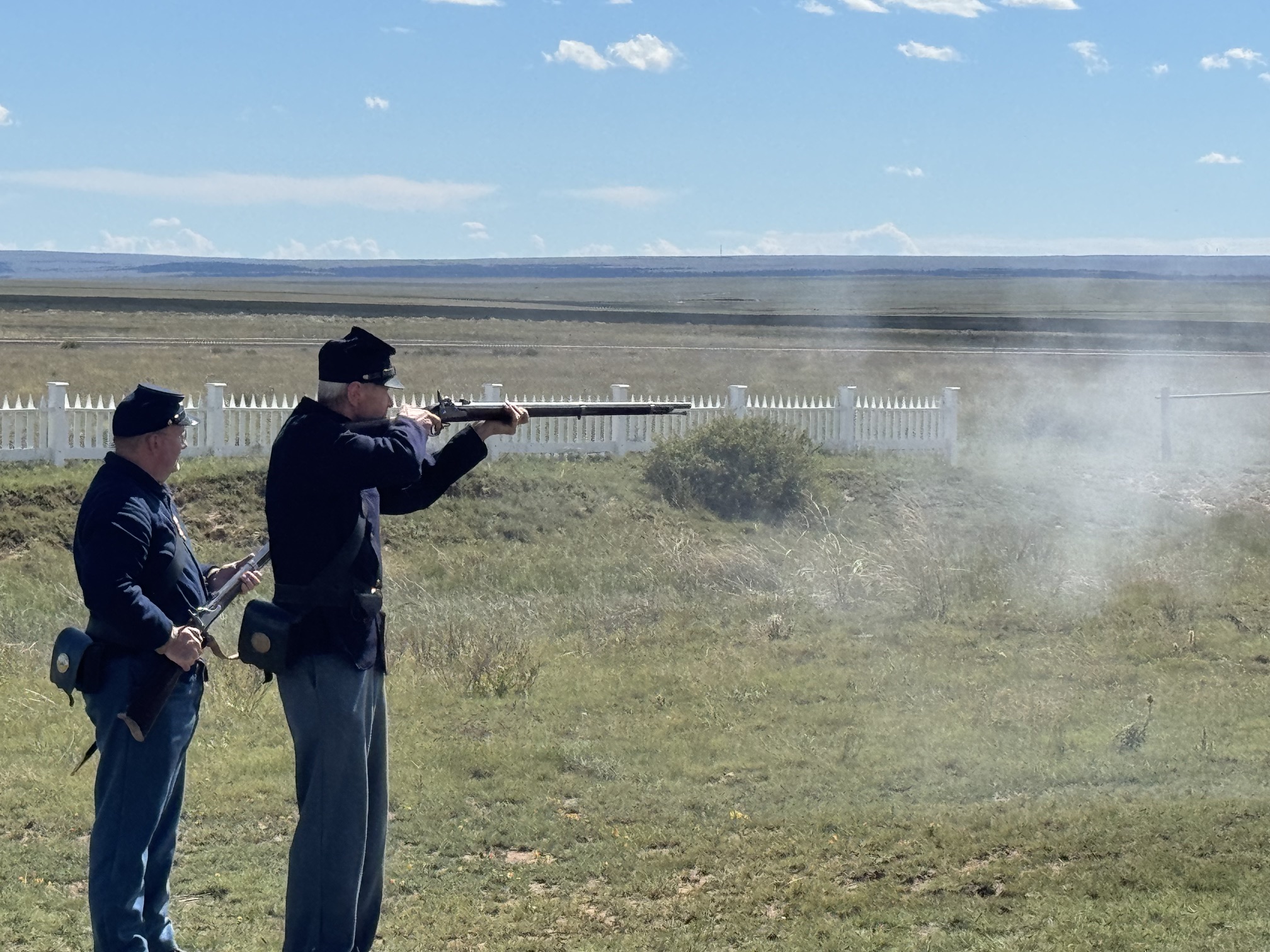 Park rangers demonstrating weapon firing in period clothing.