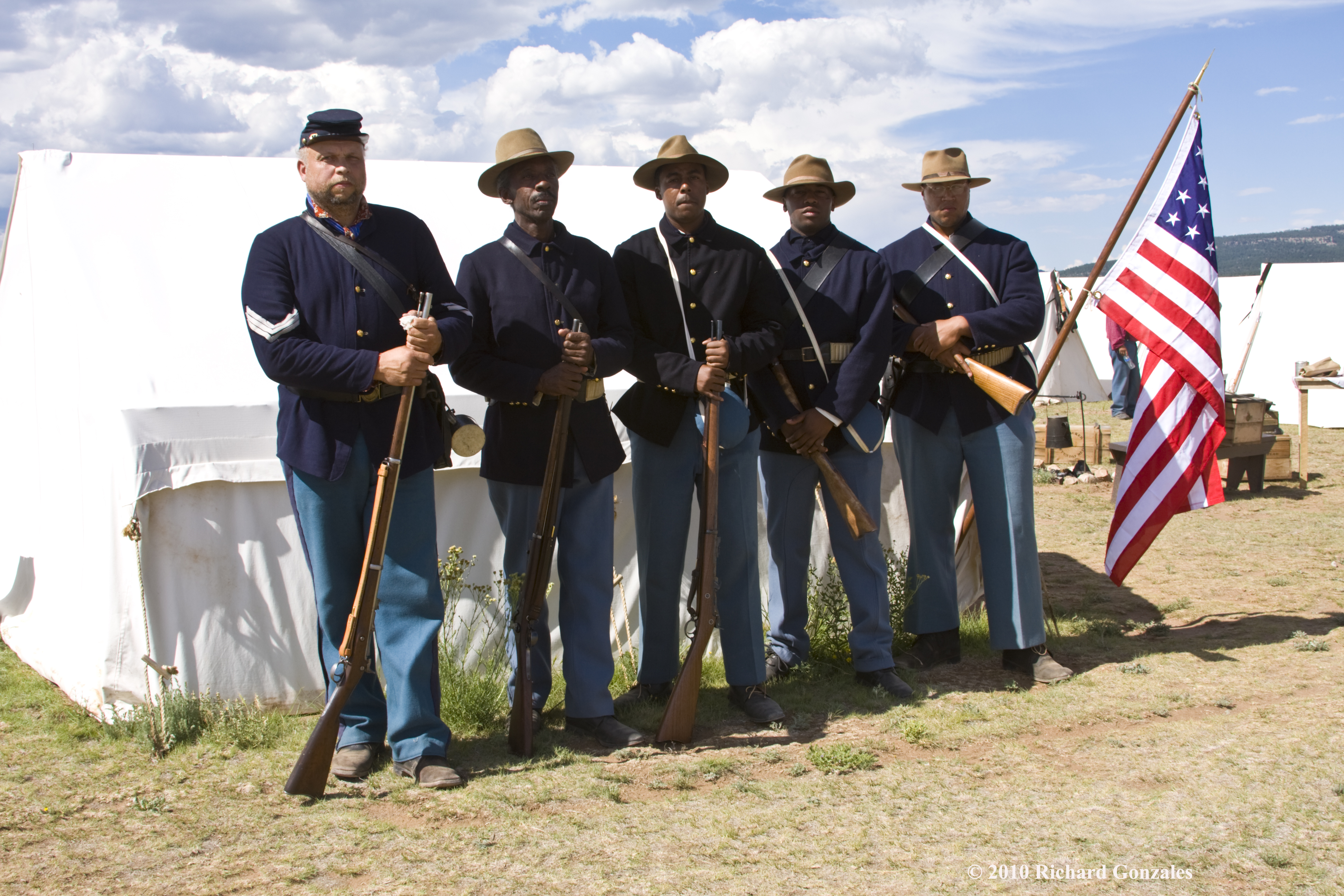 Living History volunteers in front of a tent