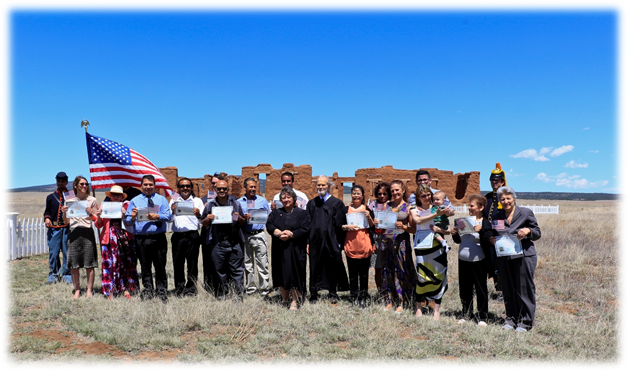 naturalization New American citizens pose at Fort Union National Monument.