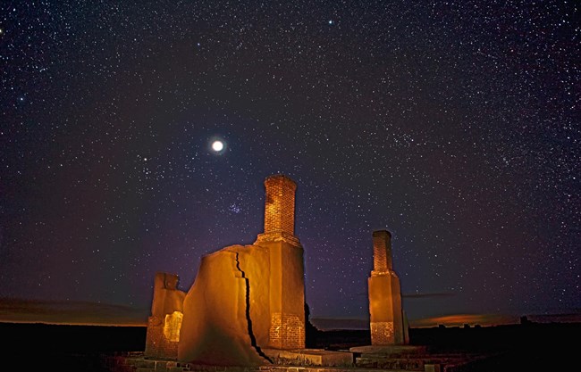 Stars, Constellations and Jupiter above adobe remnants