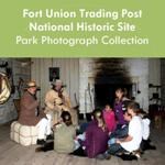 Two rangers in historic clothing talk to a group of school age children Two rangers in historic clothing talk to a group of school age children