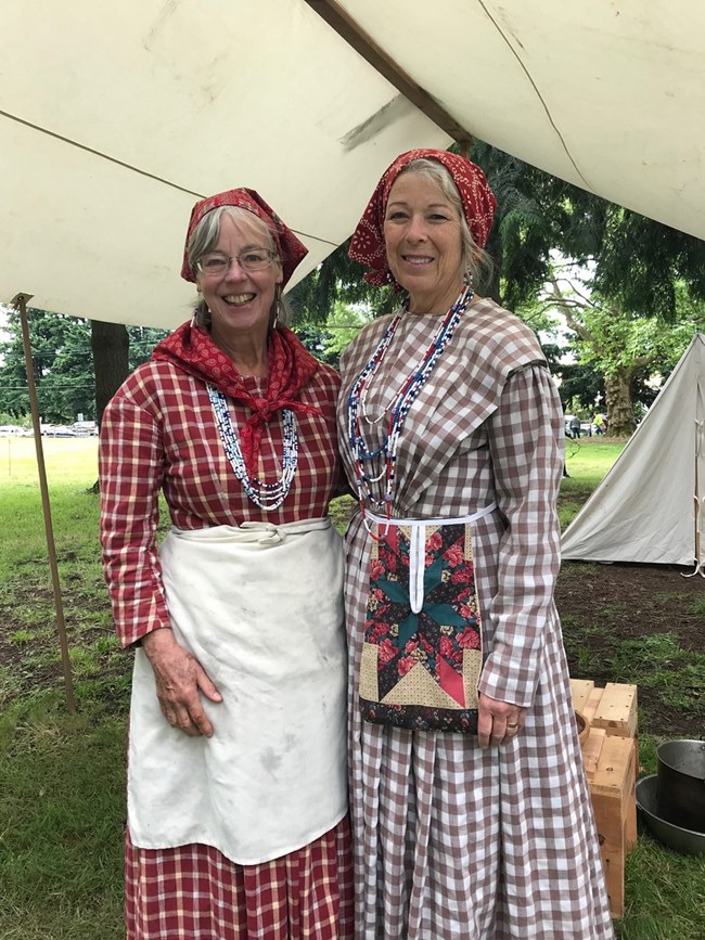 Two women in 1840s-style clothing.