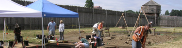 An archaeological excavation taking place inside the stockade