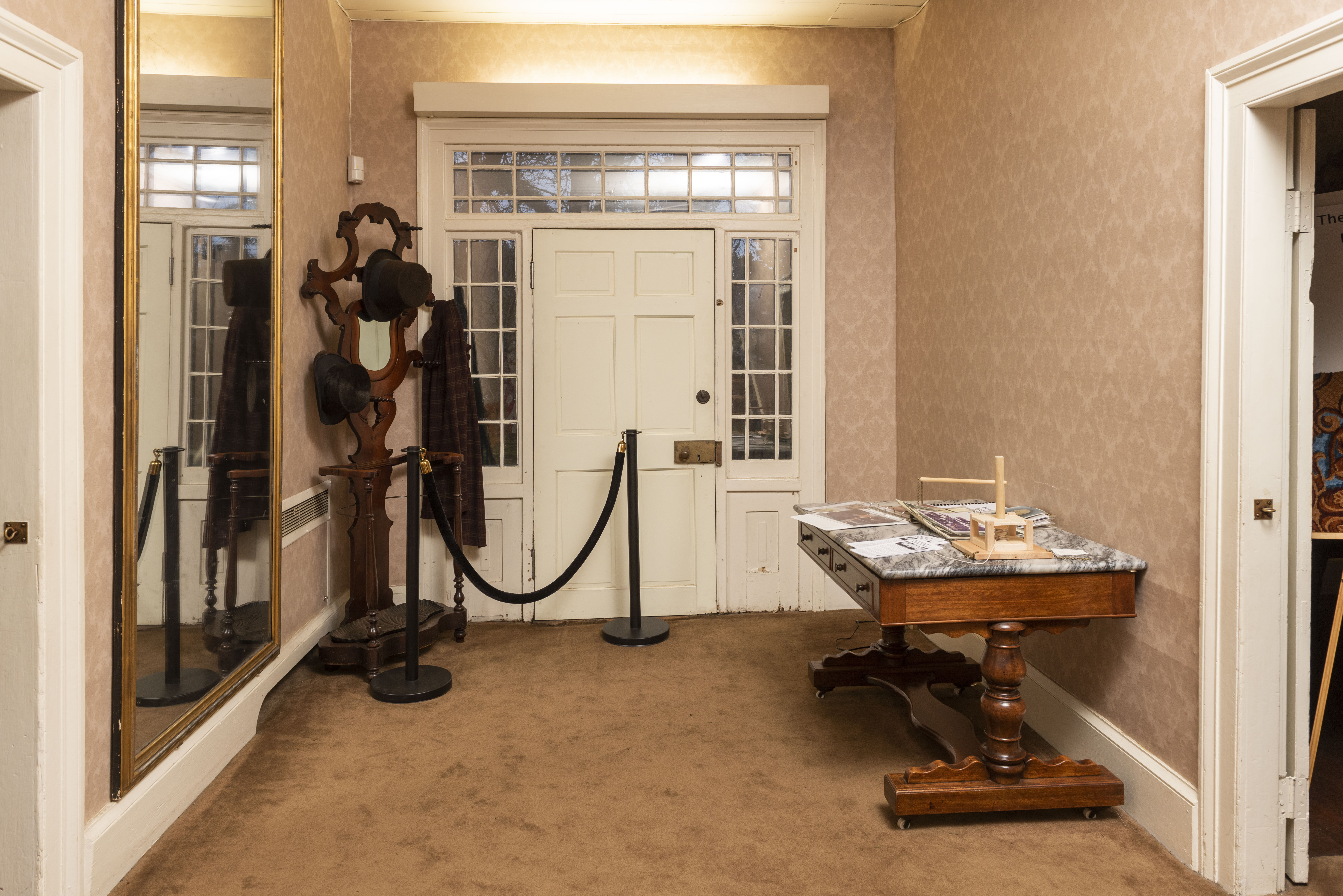 A photo of the inside of the McLoughlin House entry hall facing the back side of the former front door.