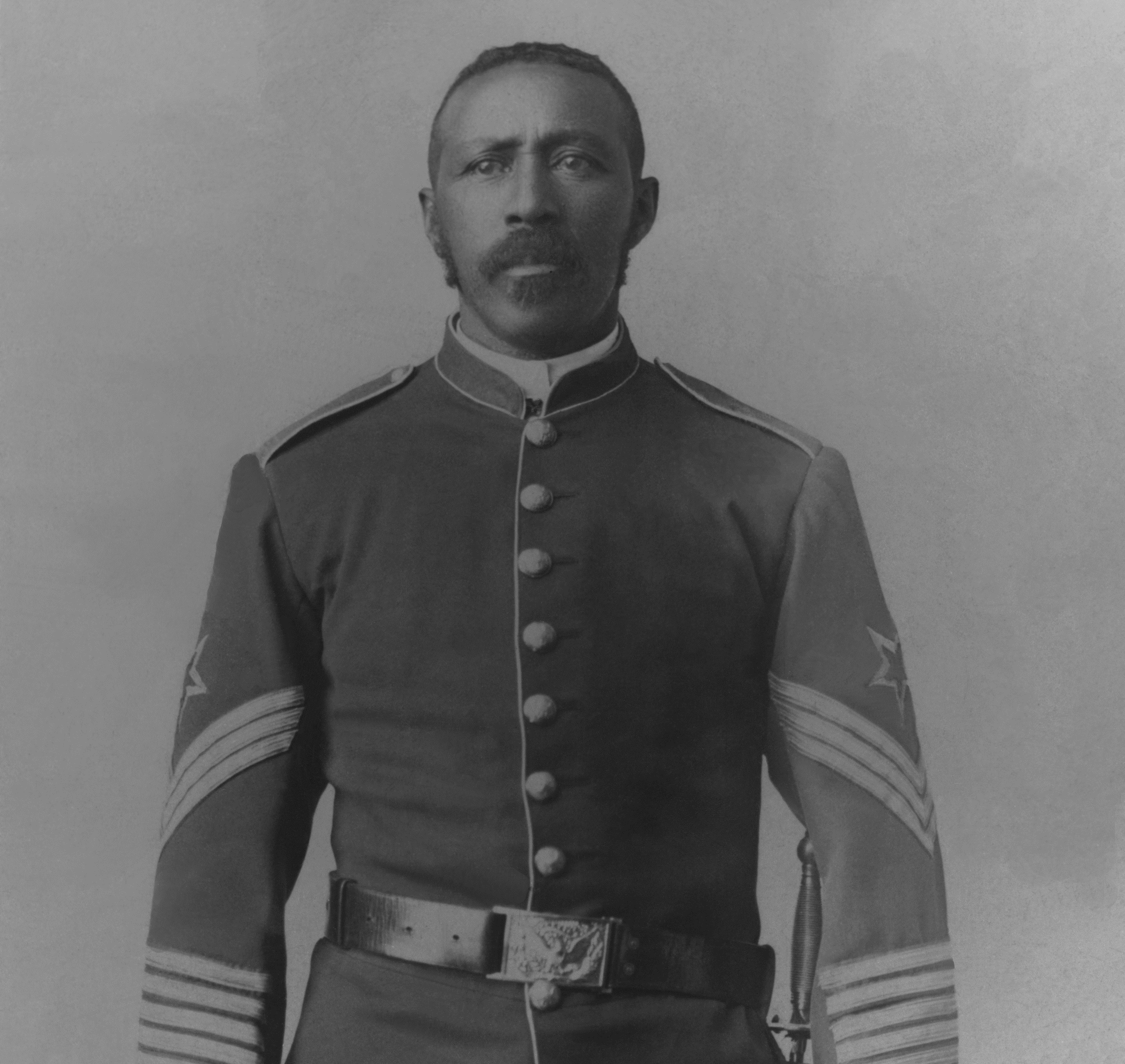 Buffalo Soldier Moses Williams Black and white photo of African American soldier in uniform.