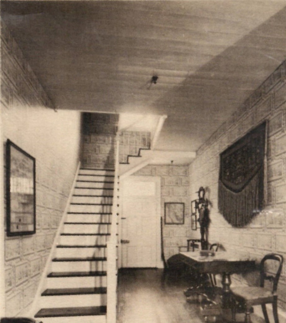 A black and white photo of the entry hall at the McLoughlin House.