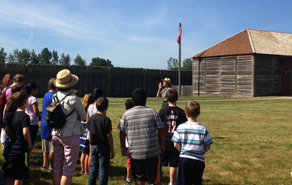Ranger Julie welcomes and address school group for a field trip for the reconstructed fort at Fort Vancouver National Historic Site. Ranger Julie welcomes and address school group for a field trip for the reconstructed fort at Fort Vancouver National Historic Site.