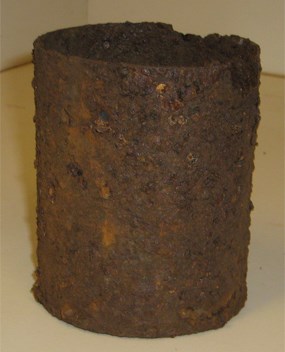image of an old rusted can found onsite in an archaeological excavation