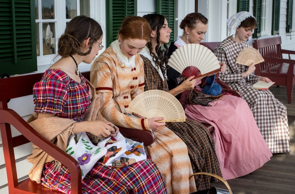 Costumed reenactors on the Chief Factor's House Veranda