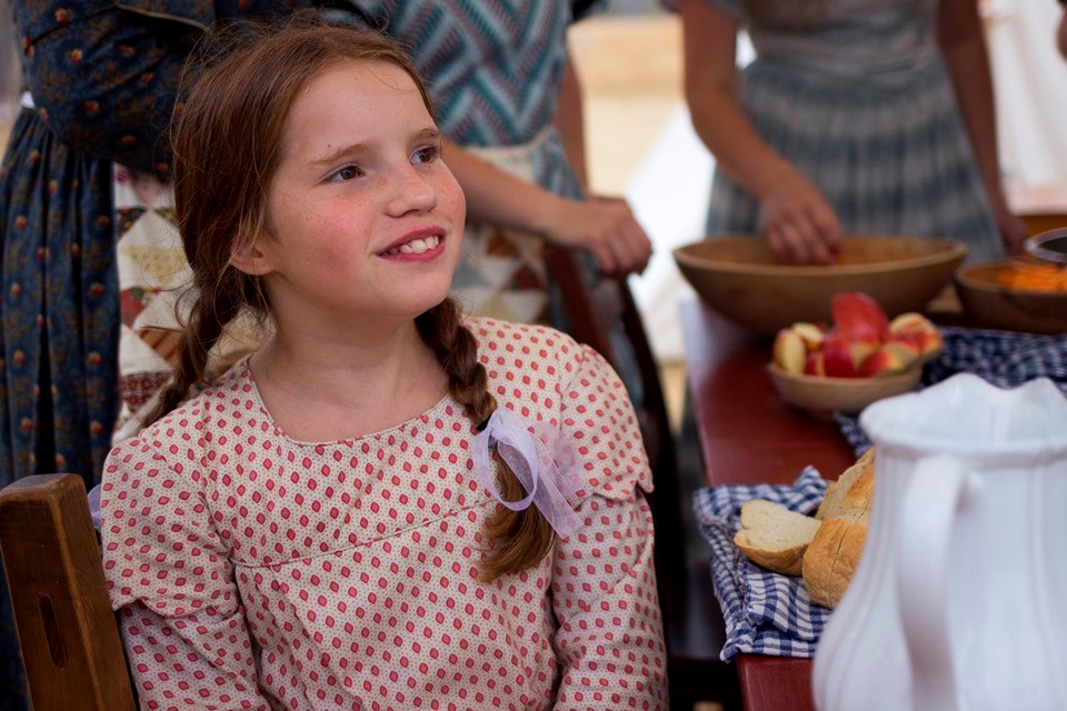 Photo of girl wearing 1840s style dress. Photo of girl wearing 1840s style dress.