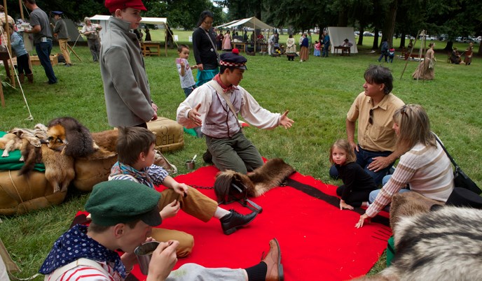 Students in the Young Engage School interpret the fur trade to the public at a special event.
