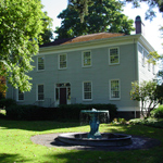 Image of the north face of the McLoughlin House on a spring morning.