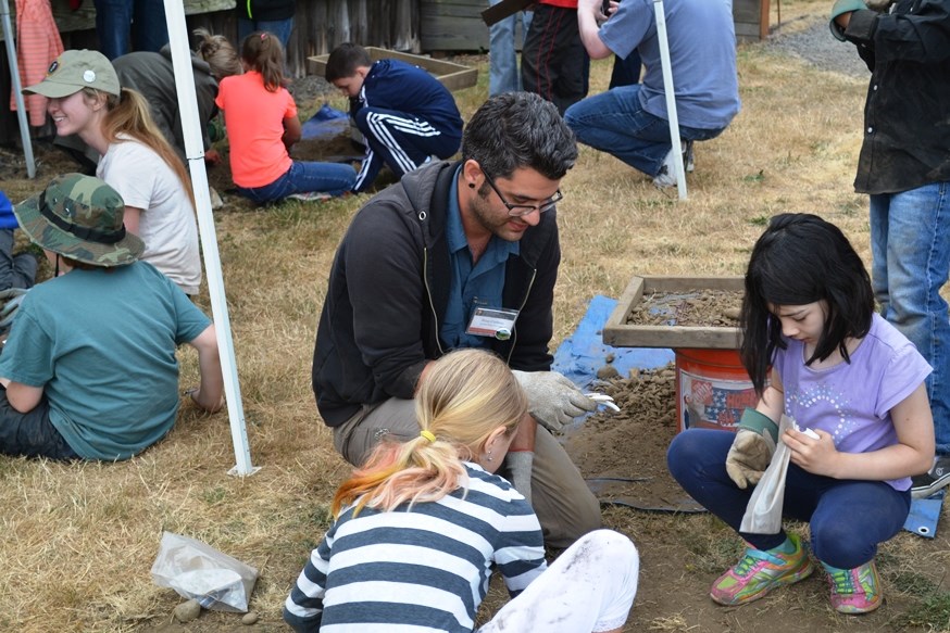 Kids ages 8-12 work with archaeology students during the Kids Dig! program