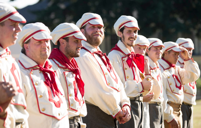 Costumed members of the Occidental Base Ball club standing in a line.