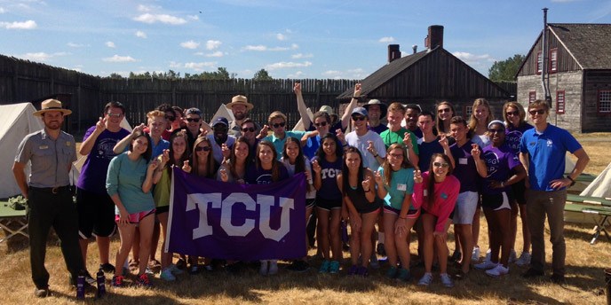 A volunteer group from TCU and park staff pose after a volunteer project.