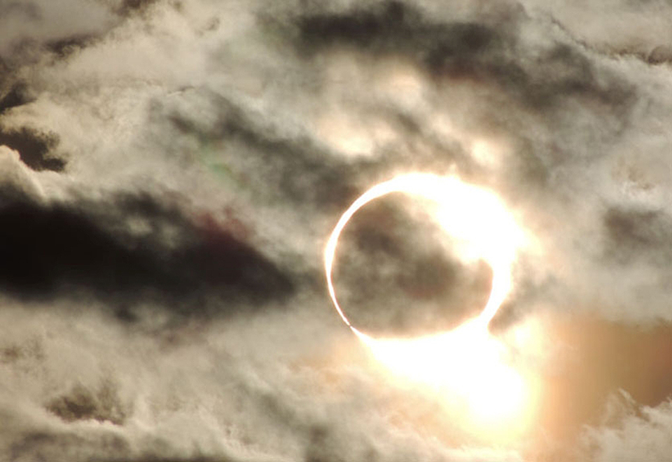 Photo of solar eclipse with ring of sunlight around moon