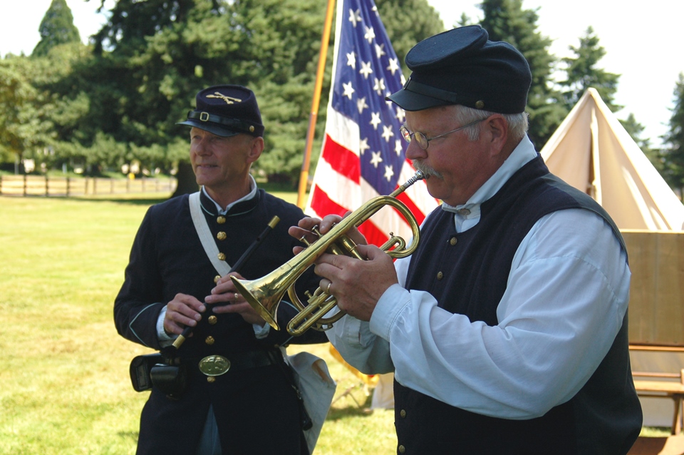 Two costumed volunteers portraying Civil War-era soldiers.