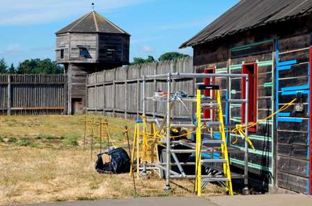 Chinking the reconstructed Carpenter Shop