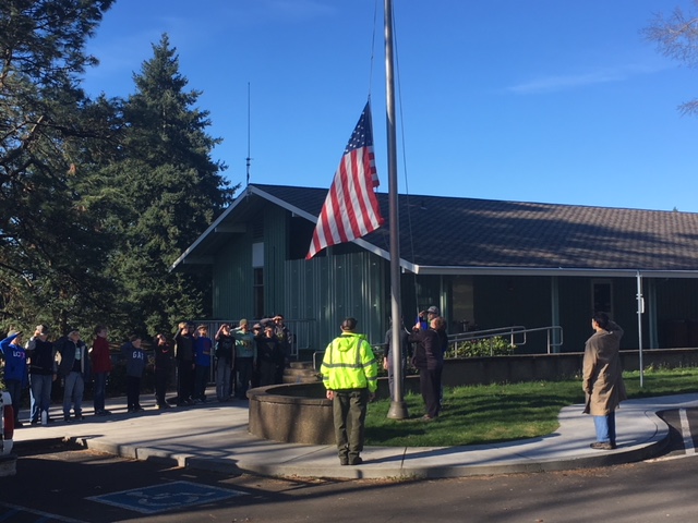 Photo of boy scouts raising an American flag at the Fort Vancouver Visitor Center.