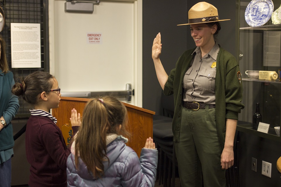 Junior Ranger Day 2018 - Photo by VIP Junelle Lawry - (4) Park Ranger swears in two junior rangers inside the fort's Visitor Center.