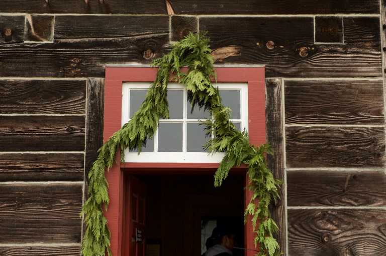 Evergreen garland over doorway of the Indian Trade Store of HBC Fort Vancouver