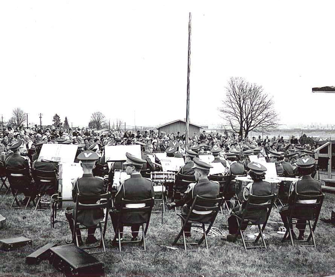 View of a band set up to play in front of a crowd at the dedication of the park's Visitor Center, 18 March 1962.