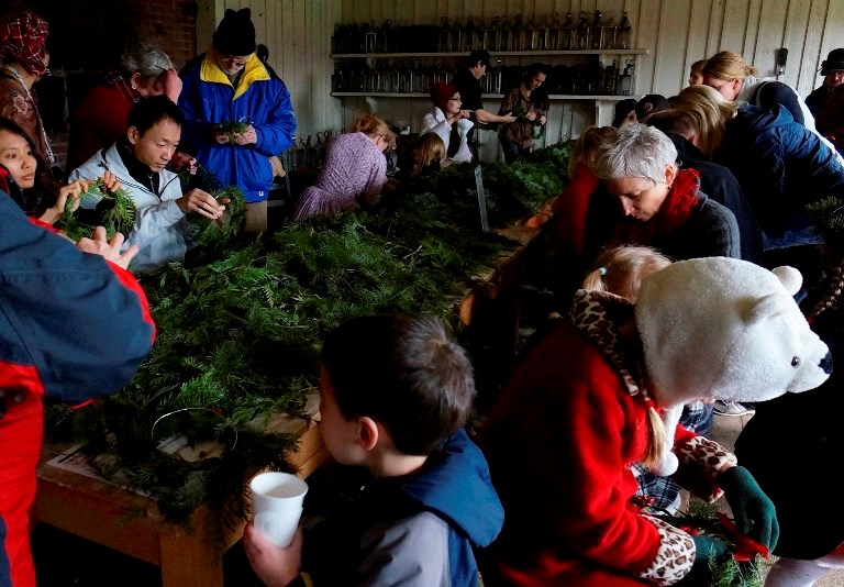 Visitors make wreaths and enjoy hot cider in the Bakehouse - Credit Joe Blanco