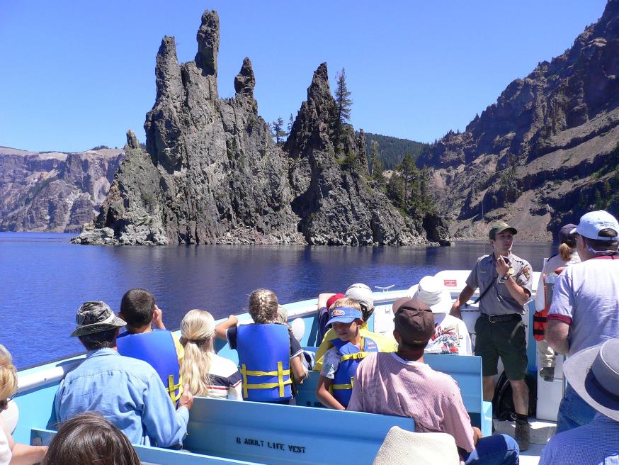 Photo of ranger giving a talk on a boat at Crater Lake National Park