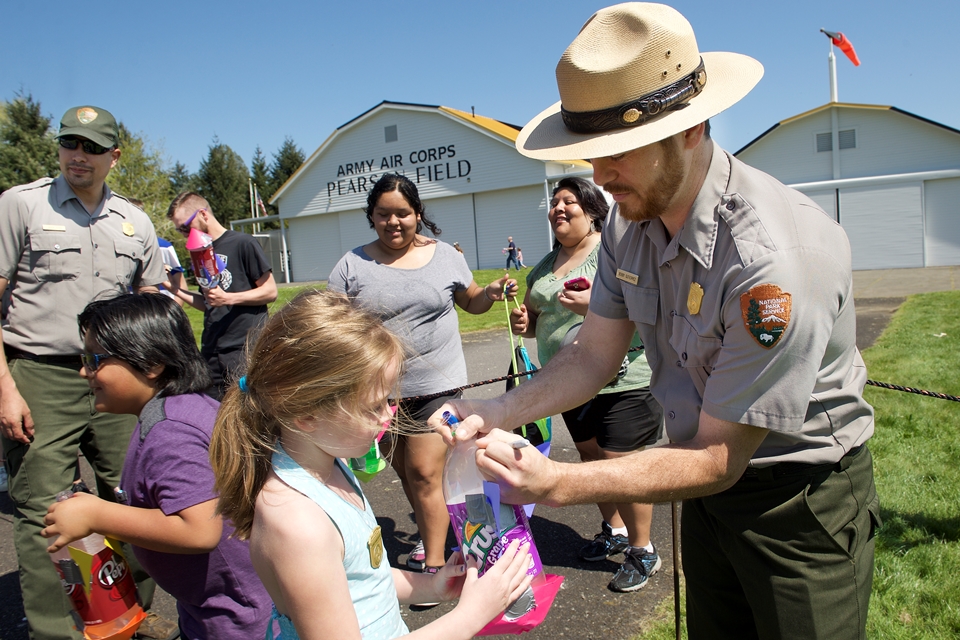 National Park Ranger helping kids with activites at Yuri's Night