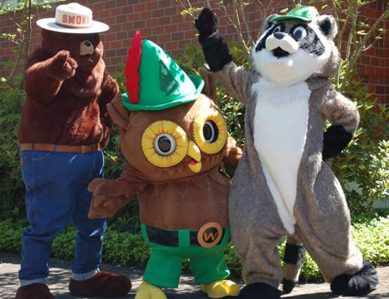 Smokey Bear and Woodsy Owl mascots from partner organizations welcome visitors to National Get Outdoors Day in 2011